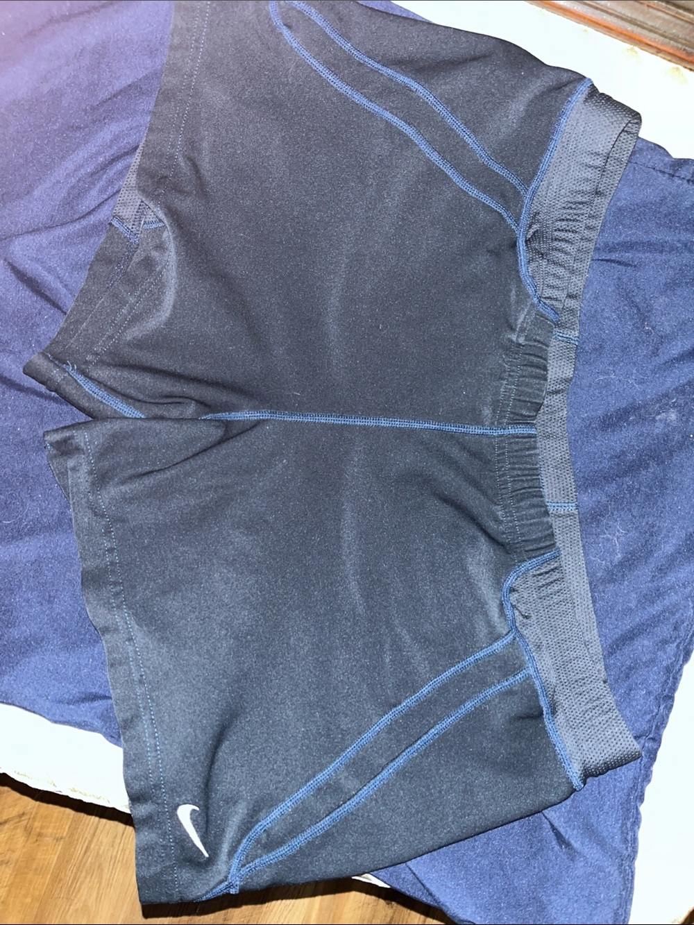 Nike Women’s Black Athletic Shorts with Blue Stitching